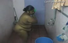 Enormous big tit woman washes herself