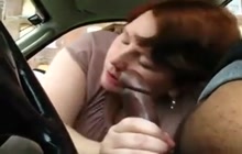 BBW sucking a black cock in the car